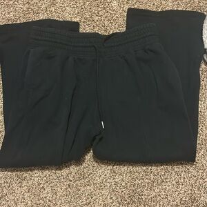 Black flared out sweat pants.